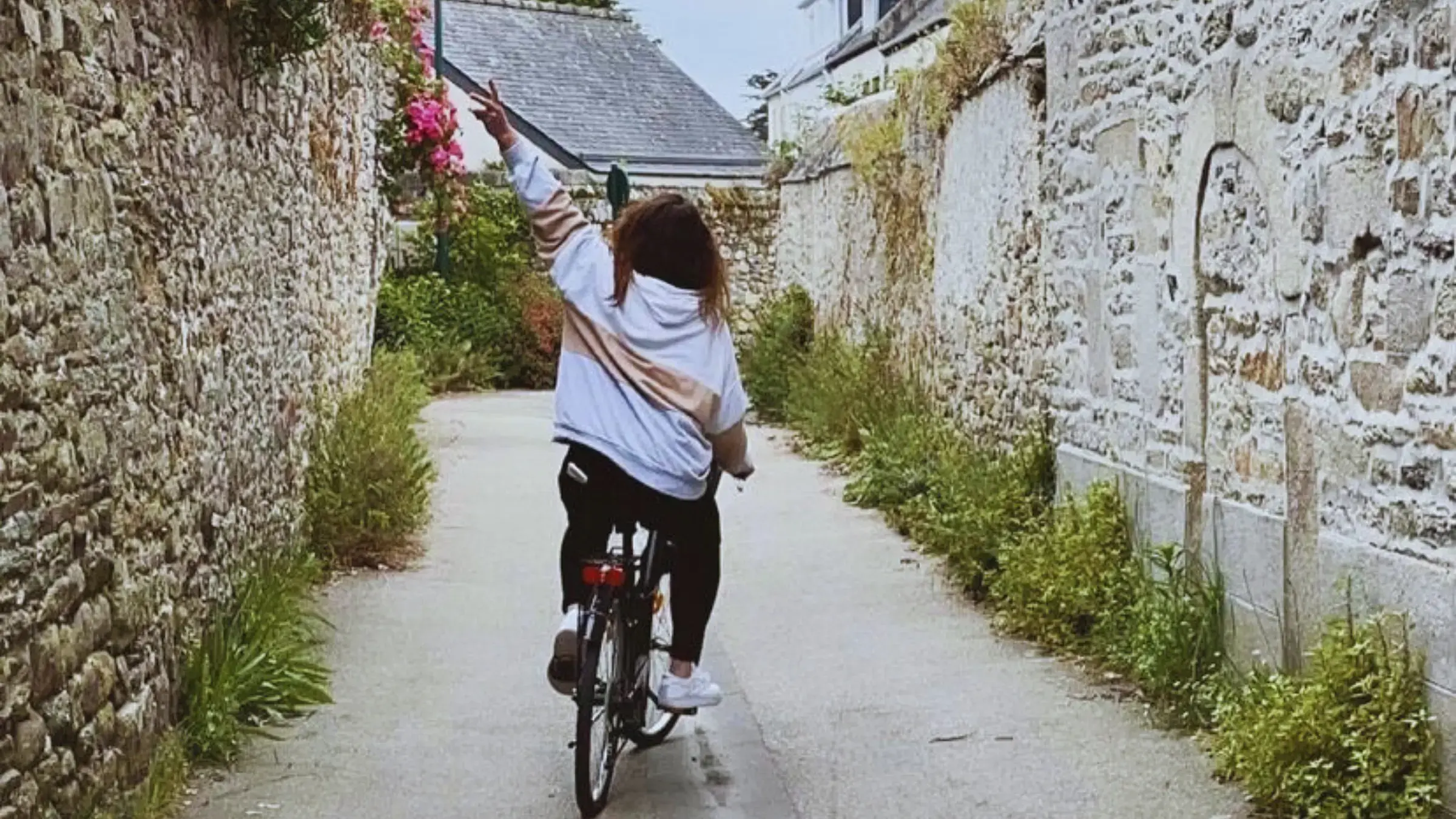 Cycling through a lane in Roscoff